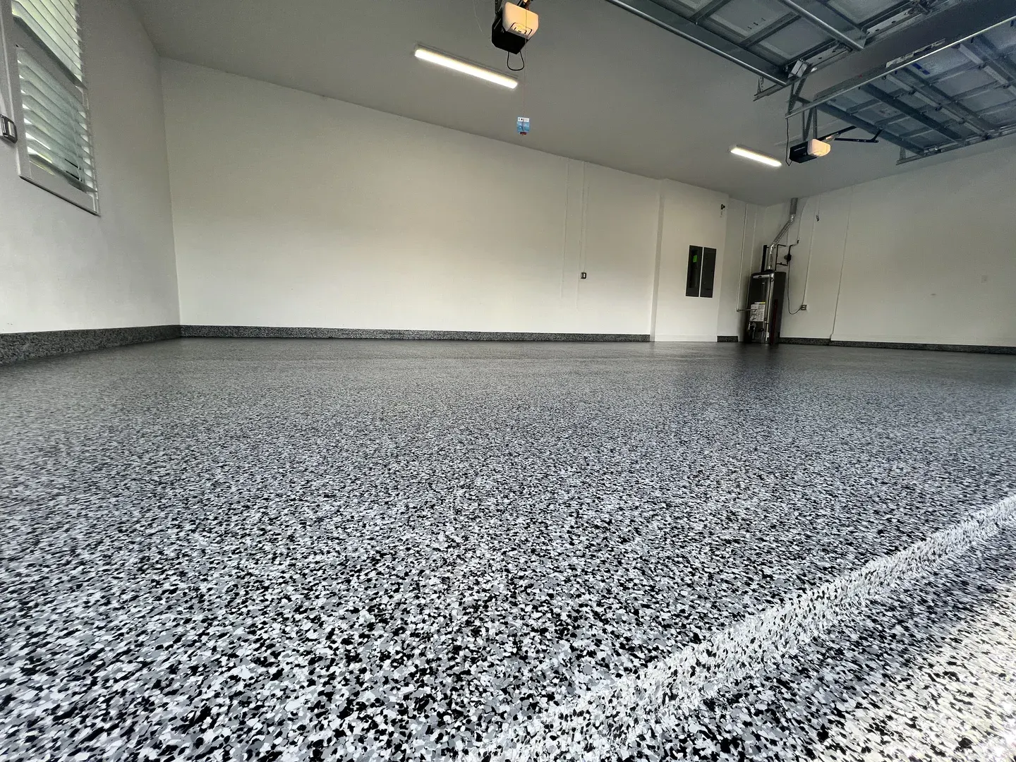 Large-scale flake epoxy floor installation by Floor Kings Epoxy
