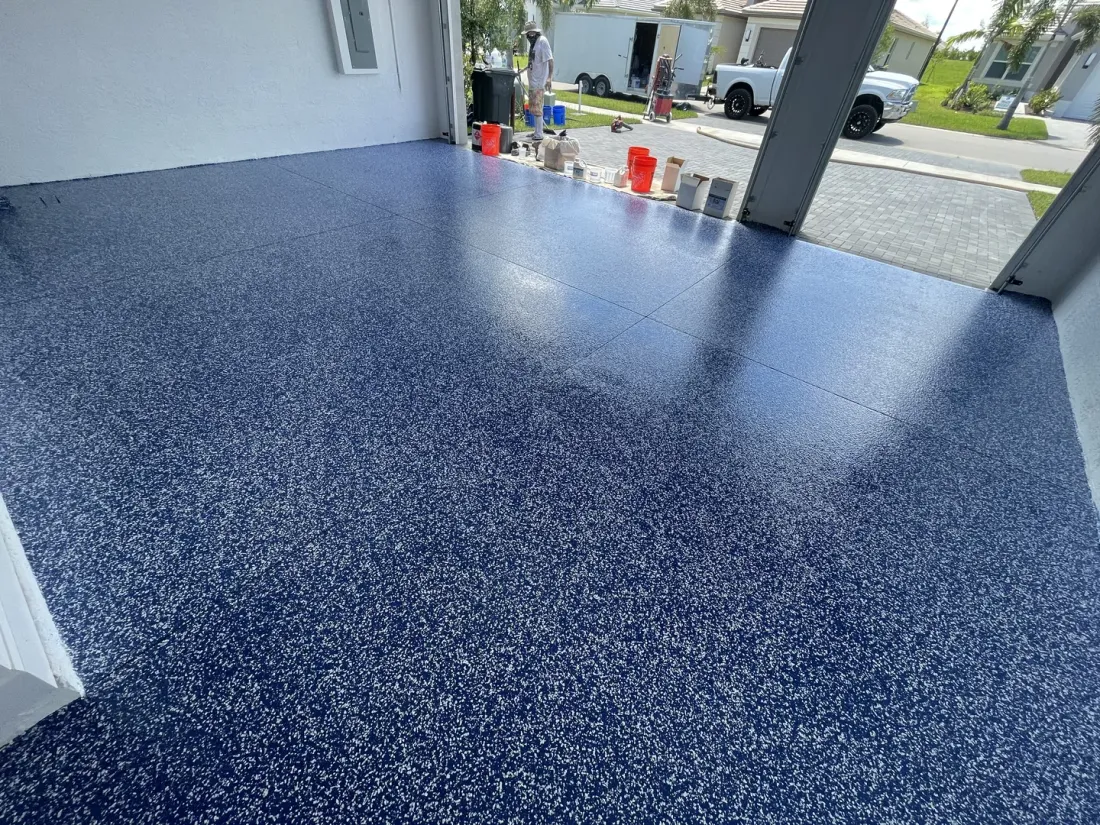 Blue flake garage floor epoxy (garage door epoxy) installation by Floor Kings Epoxy